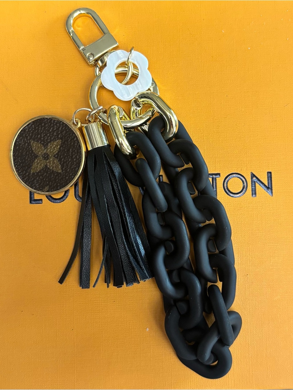 Louis Vuitton Monogram, Black Chain
Tassel Bag Charm
Disc Gold tone hardware